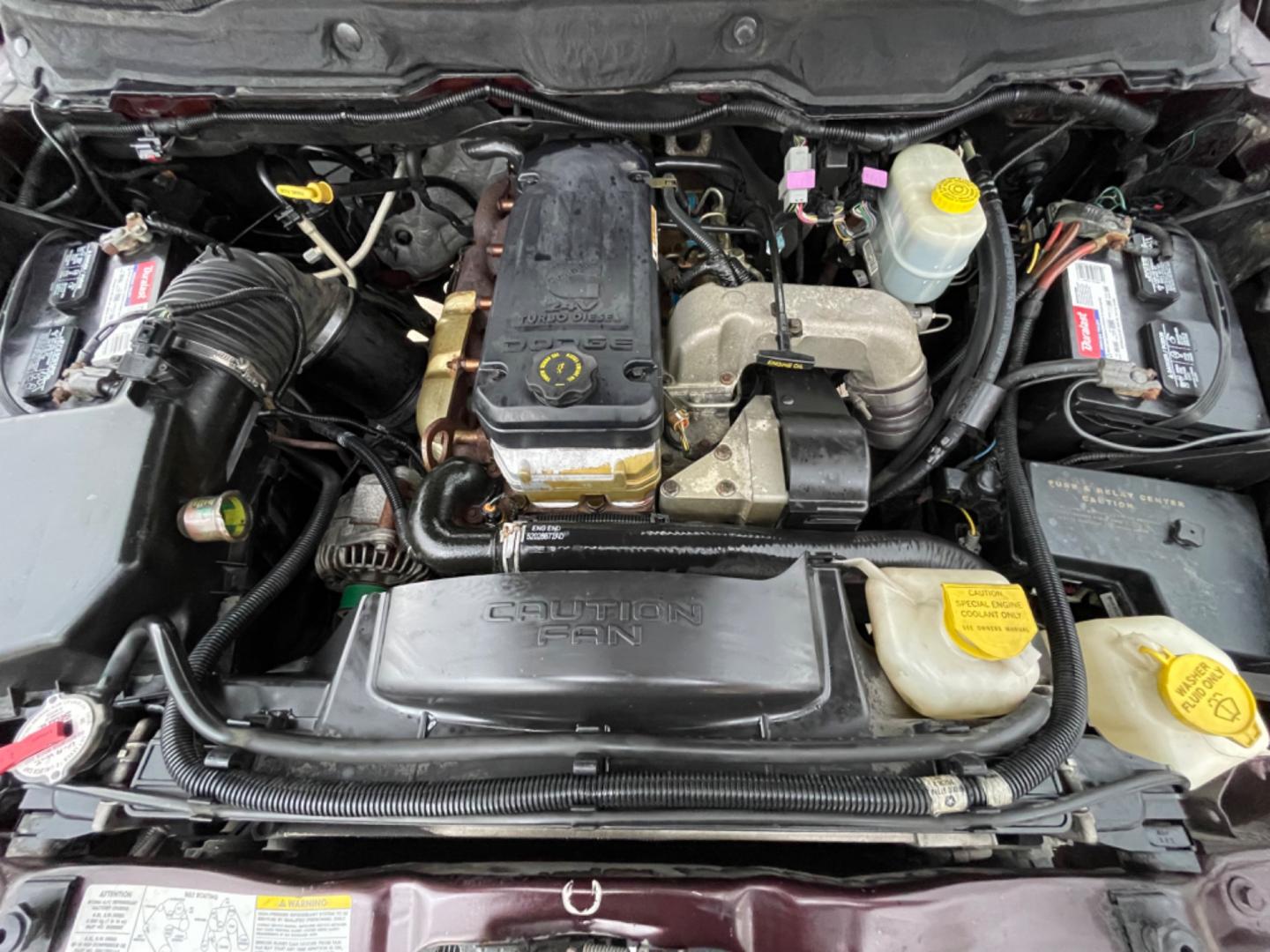 2004 Maroon /Black Dodge Ram 2500 Laramie 2WD (3D7KA26C44G) with an 5.9L L6 OHV 24V TURBO DIESEL engine, Automatic transmission, located at 1501 West 15th St., Houston, 77008, (713) 869-2925, 29.797941, -95.411789 - Photo#10